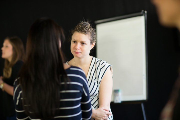 Two women in discussion on a RADA Business course