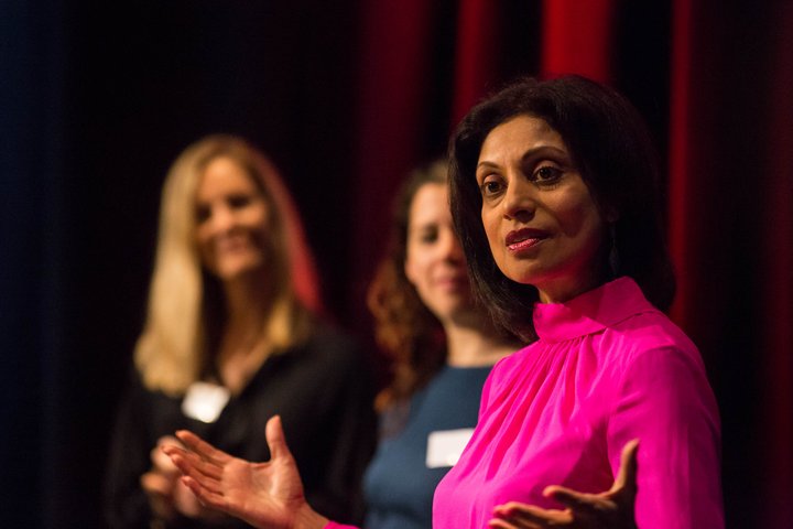 Women giving a speech at the Women's Network event