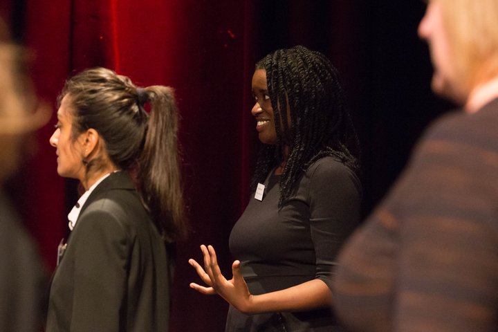 RADA Business courses for women - women take part in a class in a theatre auditorium
