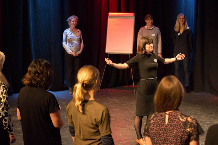 © Briony Campbell RADA Business participants stand in a semicircle.