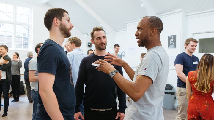 RADA Business participants speak to each other in a movement workshop.
