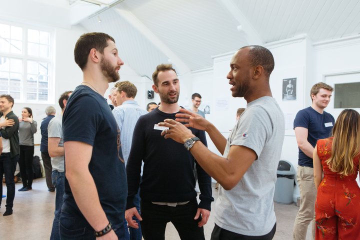 © Helen Murray RADA Business participants speak to each other in a movement workshop.