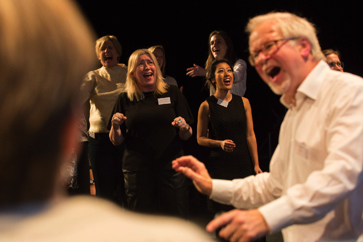 RADA Business Women's Network members sing with RADA singing coach Tom Wakeley